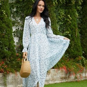 MIDI dress . Three tiered skirt. Blue and white floral print. Never Worn.